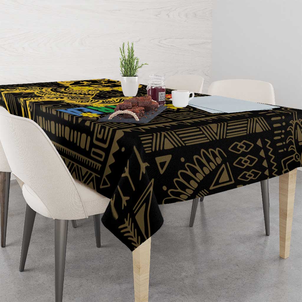 Black and gold patterned tablecloth covering a dining table with chairs