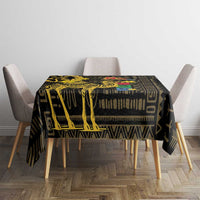 Black tablecloth with gold and tan geometric motifs, square table cover