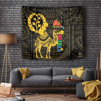 Black wall tapestry with gold camel and tree canopy, bordered with geometric patterns