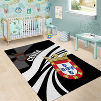 Black area rug with CEUTA lettering, shield crest, and curved black-and-white rays