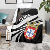 Black throw blanket with 'CEUTA' lettering and coat-of-arms crest over striped rays