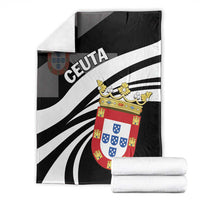 Black day blanket with 'CEUTA' text, white rays, and coat-of-arms crest; folded