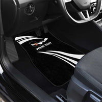 Black car floor mat with white swirl stripes and 'YOUR TEXT' graphic, front seat