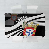 Black tablecloth with bold black-and-white diagonal stripes and colorful crest graphic.