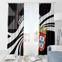 Black and white day window curtain panels with crest shield design, hung across window