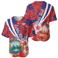 Two red and navy baseball jerseys with hibiscus print, crest front, and diagonal stripe backs