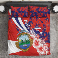 Costa Rica bedding set top view with red-and-blue hibiscus print and coat-of-arms shield