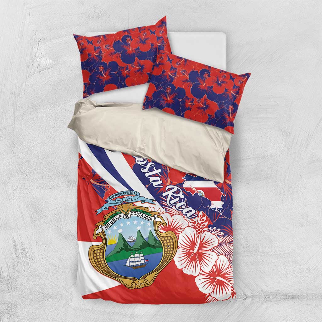Costa Rica bedding set on white surface with hibiscus print, crest emblem, and script