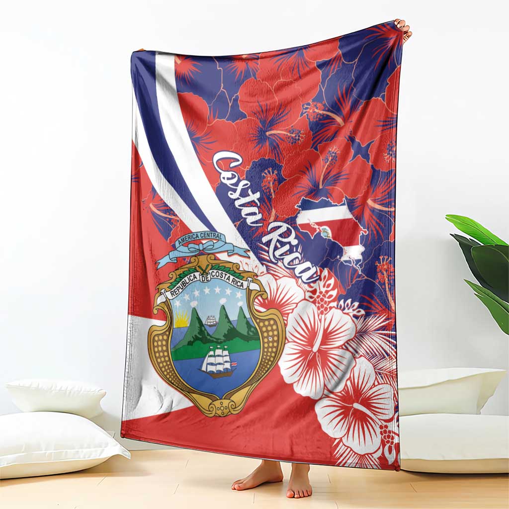 Hanging red blanket throw with Costa Rica coat of arms, hibiscus flowers, and diagonal stripe
