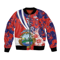 Red and navy bomber jacket with hibiscus floral print, front zip, striped chest panels, black cuffs