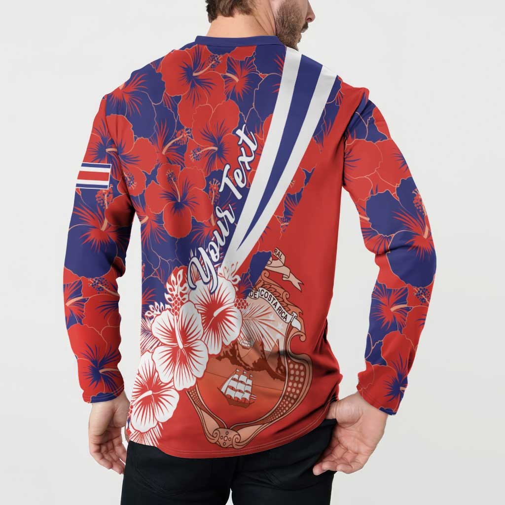 Red and navy long-sleeve button sweatshirt with back crest, hibiscus flowers, and striped sash