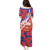 Red and blue hibiscus print midi dress with cap sleeves, back sash stripe detail