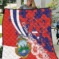 Large red and blue quilt blanket with Costa Rica crest, white stripe, hibiscus blooms