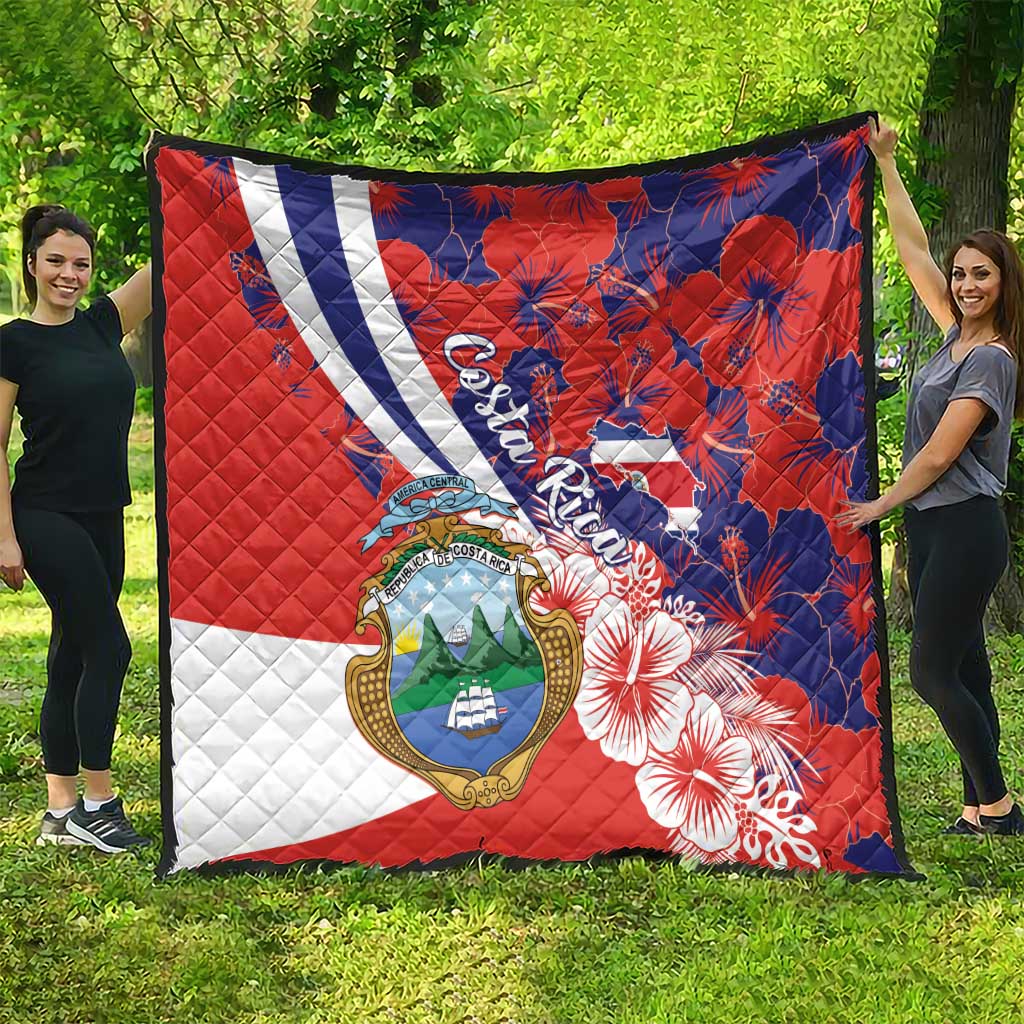 Red, white, and blue quilt blanket featuring Costa Rica crest and hibiscus flowers
