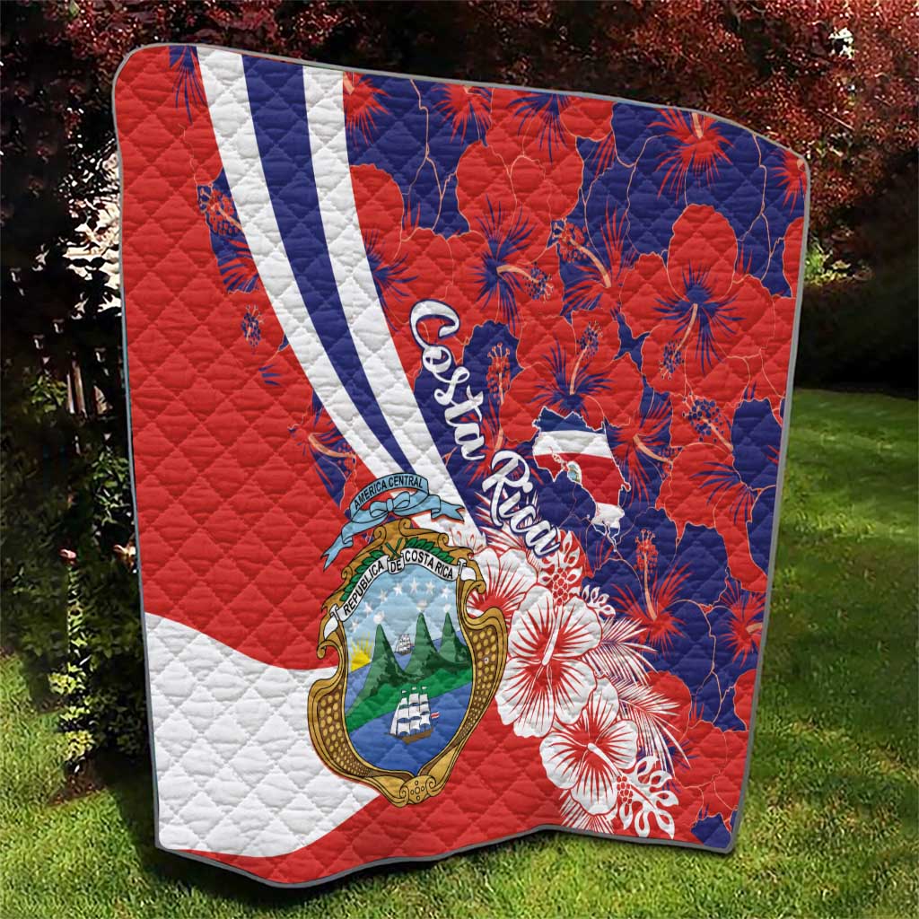 Red, white, blue quilt blanket with Costa Rica crest and hibiscus flower design