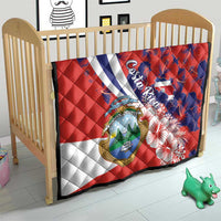 Quilt blanket with red, white, and blue blocks, Costa Rica crest, hibiscus flower pattern