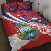 Red quilt bed set with Costa Rica coat of arms and blue hibiscus floral pattern