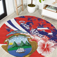 Red round area rug with Costa Rica coat of arms, hibiscus and flag stripes pattern