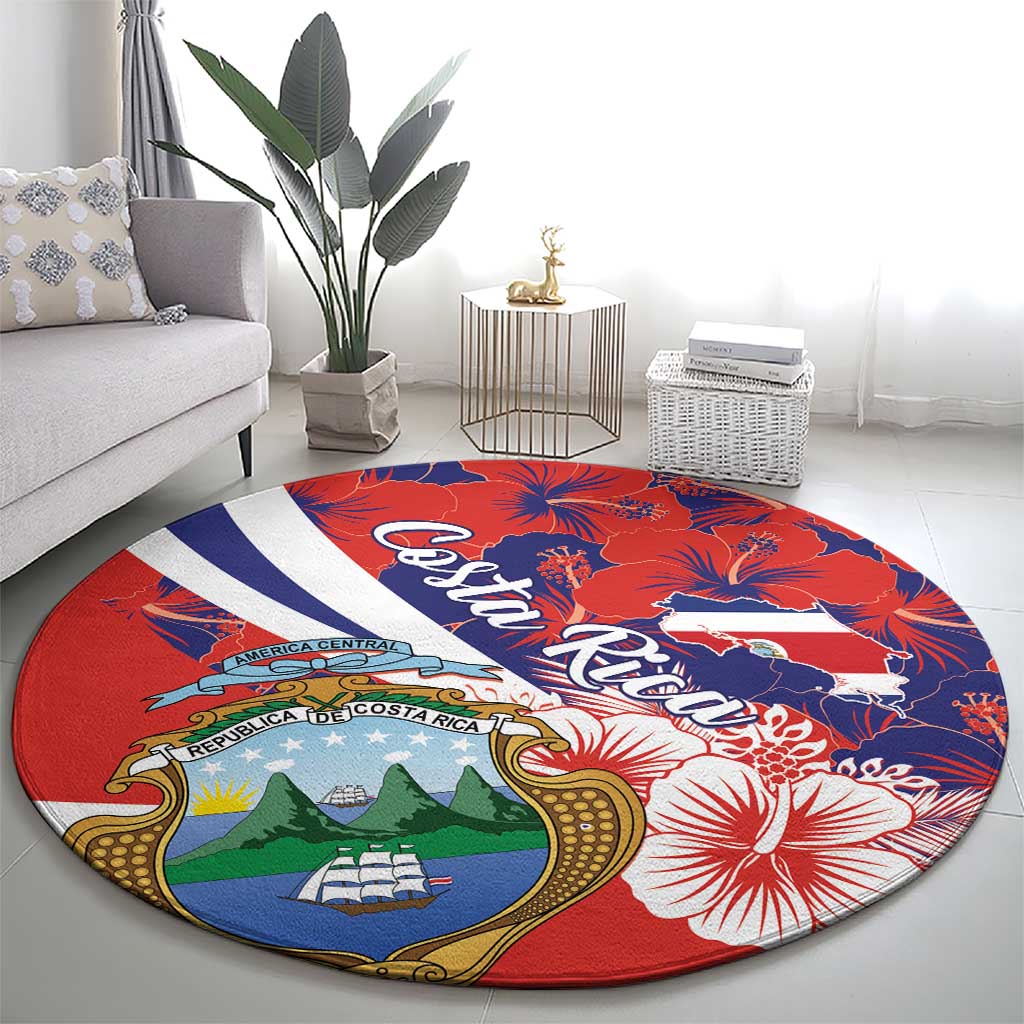 Round red carpet rug with Costa Rica crest, hibiscus blooms, and blue-white diagonal band