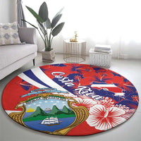 Round red carpet rug with Costa Rica crest, hibiscus blooms, and blue-white diagonal band