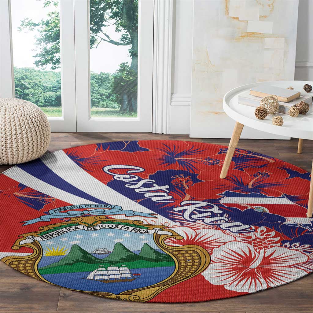 Round red rug with Costa Rica coat of arms, hibiscus flowers, and white-blue diagonal stylized lettering