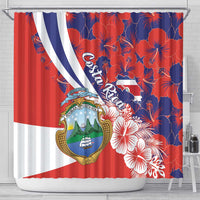 Costa Rica shower curtain showing coat of arms and hibiscus floral print in red and blue