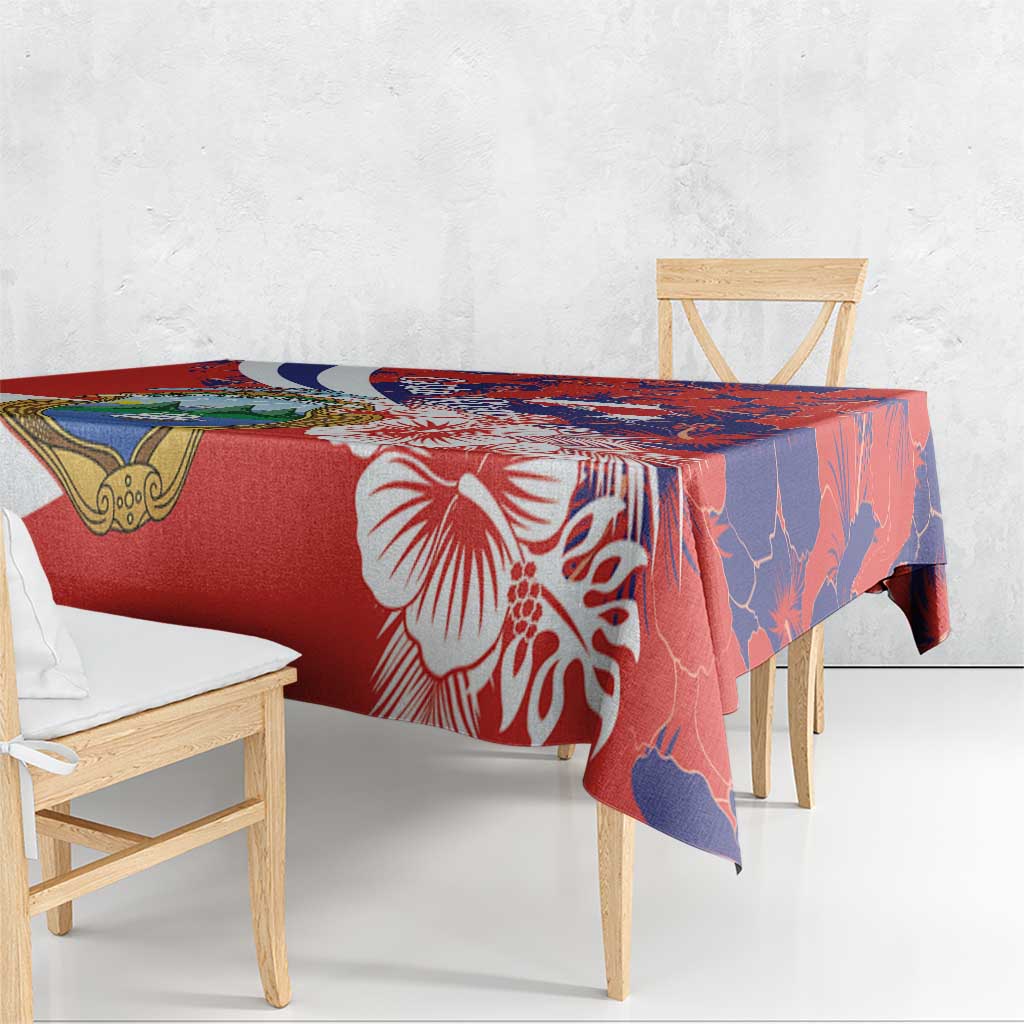 Red and blue hibiscus patterned tablecloth draped over dining table