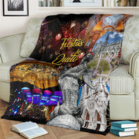 Ecuador blanket on a striped couch with fireworks, illuminated city lights, and cathedral artwork