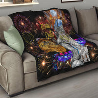 Ecuador quilt on sofa, black throw with “Fiestas de Quito,” fireworks and cathedral figure