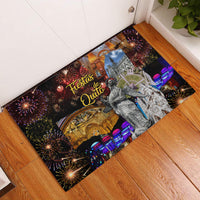 Rectangular rubber doormat with dark Fiesta de Quito artwork, fireworks and city map
