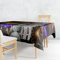 Rectangular tablecloth draped over table edge with fireworks and grayscale statue/buildings