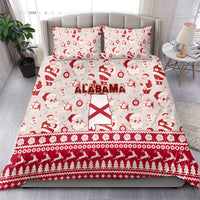Red Alabama Christmas bedding set featuring Santa faces, gifts, and Alabama flag center, pillows