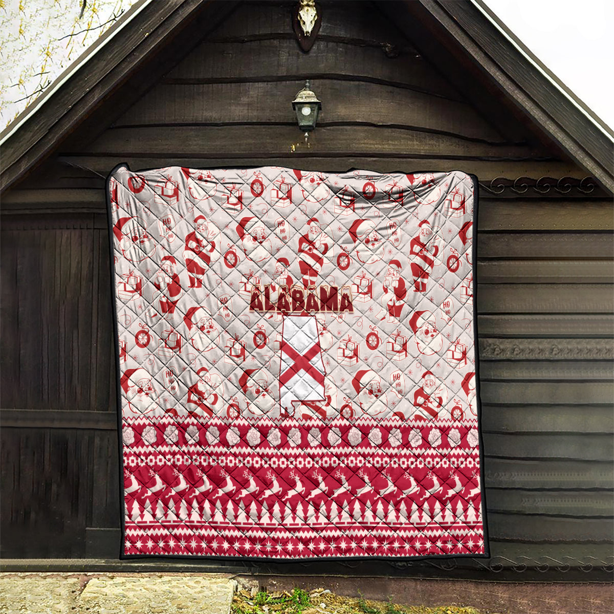 Alabama Christmas quilt hanging on a porch, red and white Santa pattern with Alabama text