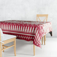 Red holiday tablecloth with geometric triangle and star motifs