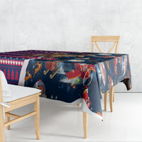 Christmas tablecloth in navy blue with space Santa and cowboy figures, red patterned edge