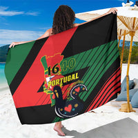 Black Portugal 1640 printed sarong with diagonal green, red, and crest graphic