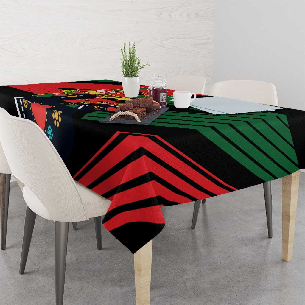 Black tablecloth with bold red, green, and navy chevron stripes and Portugal emblem