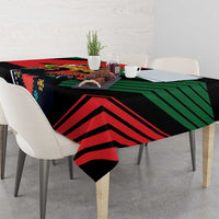 Black tablecloth with bold red, green, and navy chevron stripes and Portugal emblem