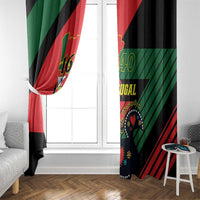 Black window curtain with Portugal flag-style graphic in red and green, floor-length.