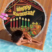 Round Kwanzaa beach blanket with Happy Kwanzaa text, candle and fruit basket design, fringed