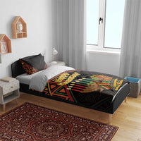 Black Happy Kwanzaa comforter set on bed with two coordinating pillowcases and matching print
