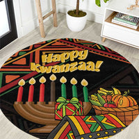 Round black Kwanzaa rug featuring "Happy Kwanzaa" text, candles, and a wrapped gift