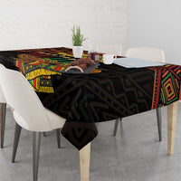 Black Kwanzaa tablecloth with geometric band and 'Happy Kwanzaa' graphic across the top.