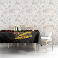 Black Kwanzaa tablecloth with 'Happy Kwanzaa' graphic and multicolor geometric motifs.