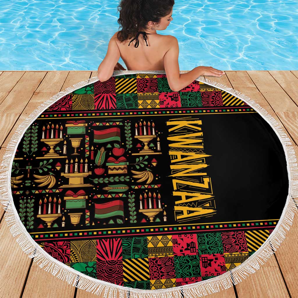 Round beach blanket on deck, black center with colorful African Kwanzaa pattern and white fringe