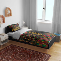 Black African pattern duvet set with multicolor Kwanzaa-style artwork and pillowcases on bed