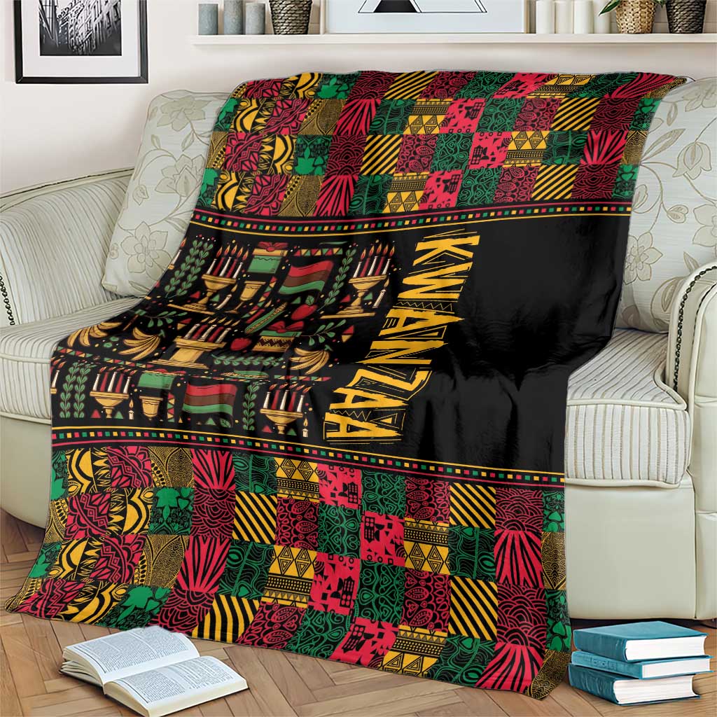 Kwanzaa African pattern blanket on an armchair, black field with colorful tiles and KWANZAA print
