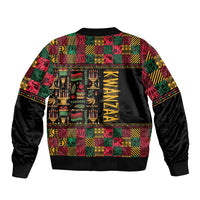 Unisex black bomber jacket with multicolor African Kwanzaa print and vertical “KWANZAA” logo