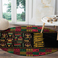 Round black rug with colorful African pattern strips and yellow vertical word on center