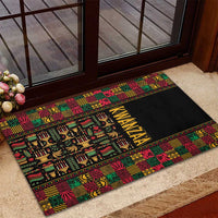 Black rubber doormat with colorful Kwanzaa African pattern border and central 'KWANZAA'